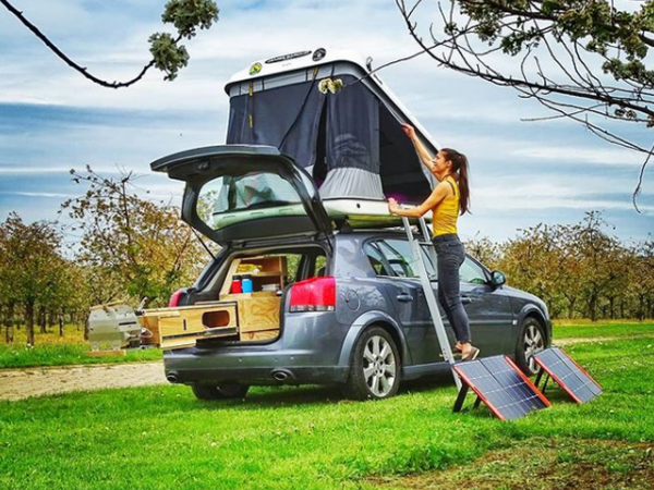 car with bed on the roof