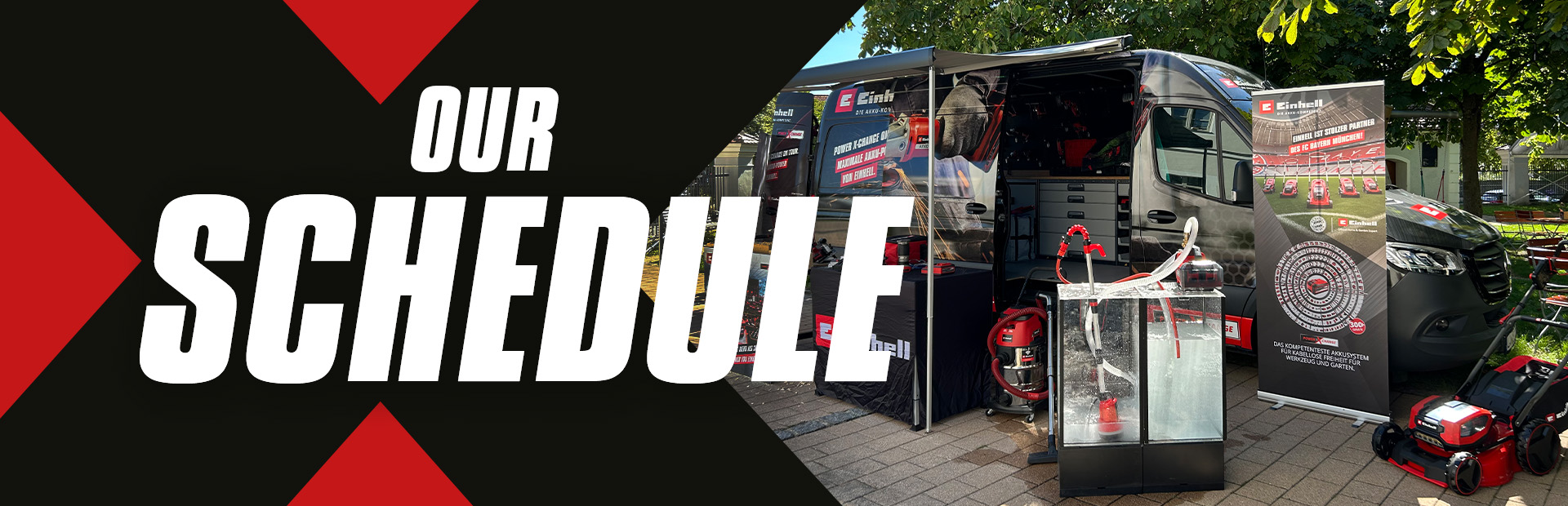 Billboard with the text "Our Schedule," next to a displayed Einhell van featuring products and promotional materials.